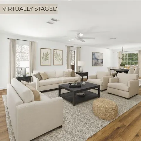 a living room with furniture and windows