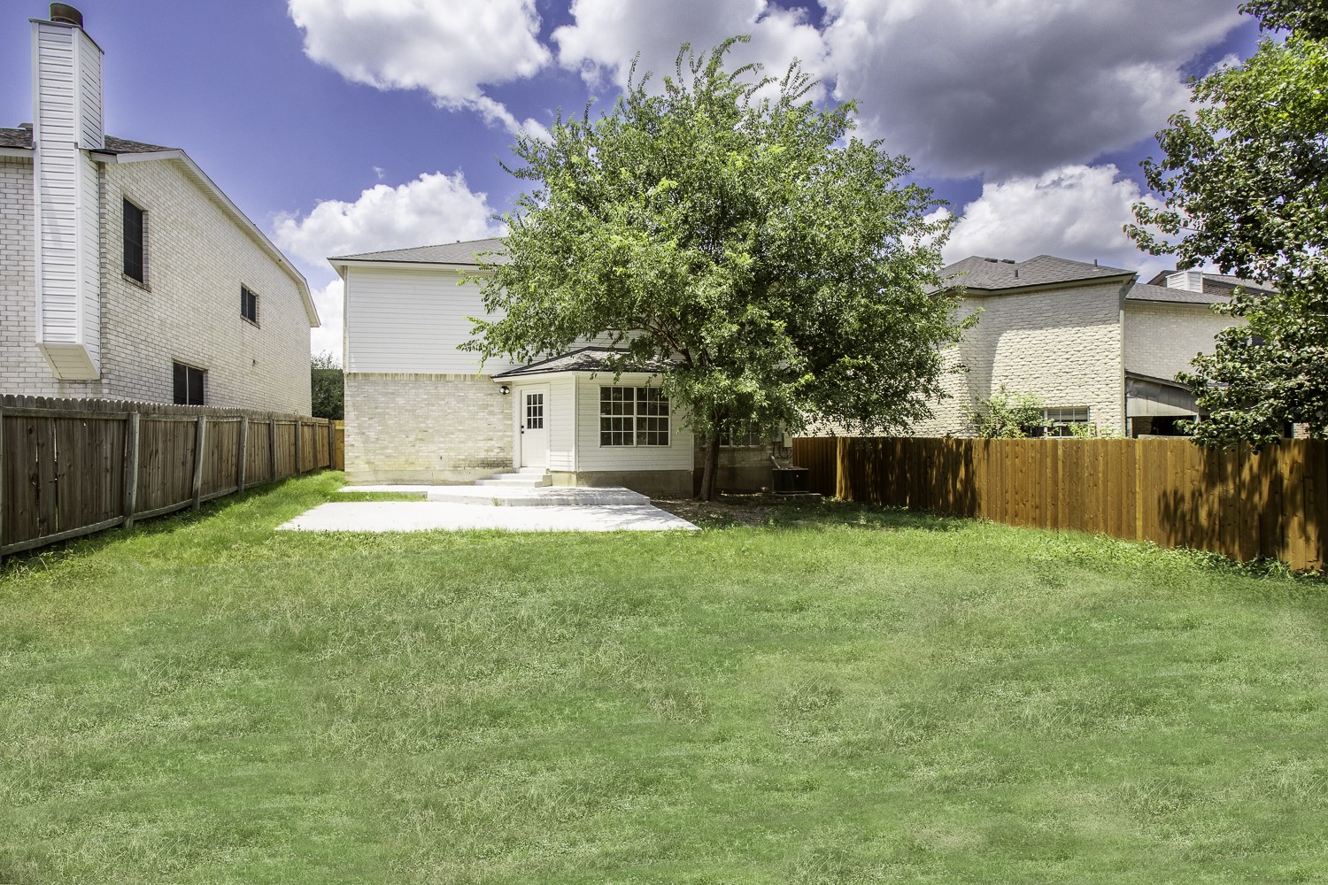 2431 Lavendale Court Austin, TX 78748 - Photo 22 of 22 Rear view of property with a patio and a fenced backyard
