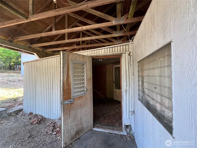 a kitchen with a refrigerator and a stove