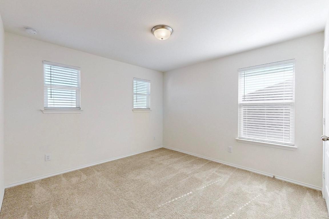 17308 Crazy Arm Road Round Rock, TX 78664 - Photo 14 of 22 a view of an empty room with a window