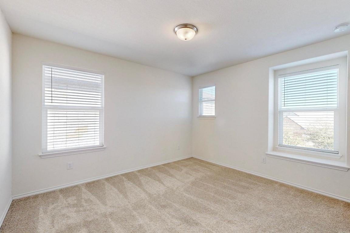 17308 Crazy Arm Road Round Rock, TX 78664 - Photo 16 of 22 a view of an empty room with a window