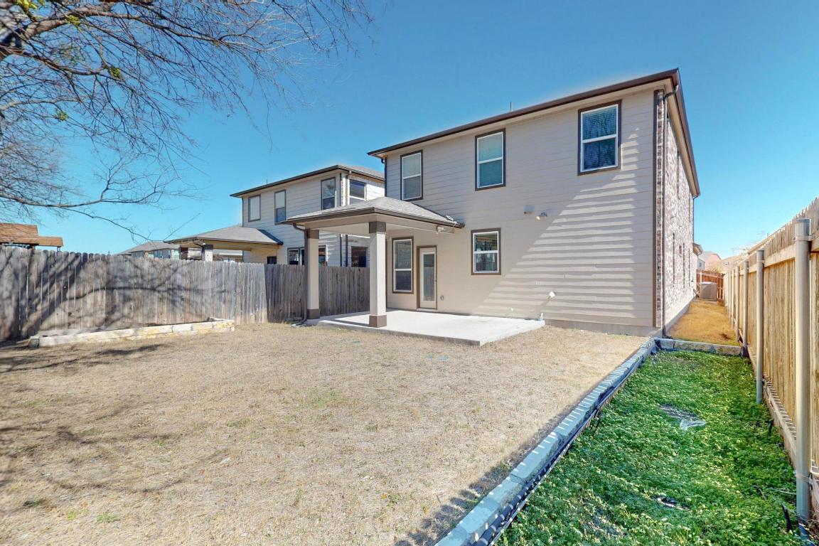 17308 Crazy Arm Road Round Rock, TX 78664 - Photo 19 of 22 a front view of a house with a yard