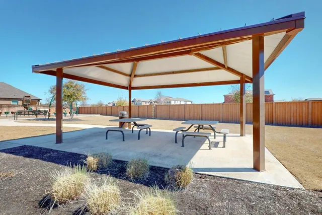 a view of a park with swings and slides