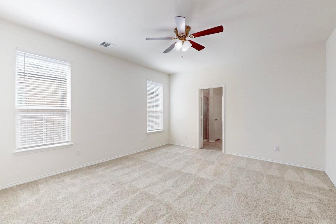 17308 Crazy Arm Road Round Rock, TX 78664 - Photo 9 of 22 a view of an empty room with a window