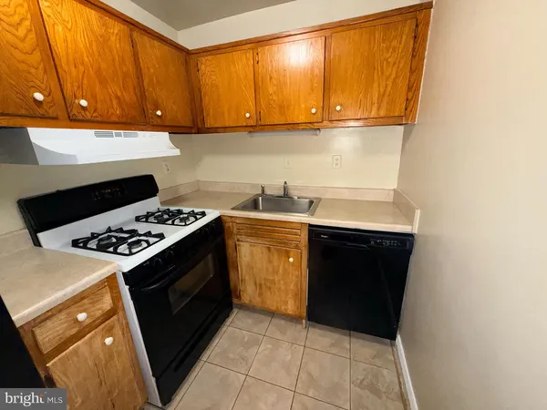 a kitchen with a stove and a microwave