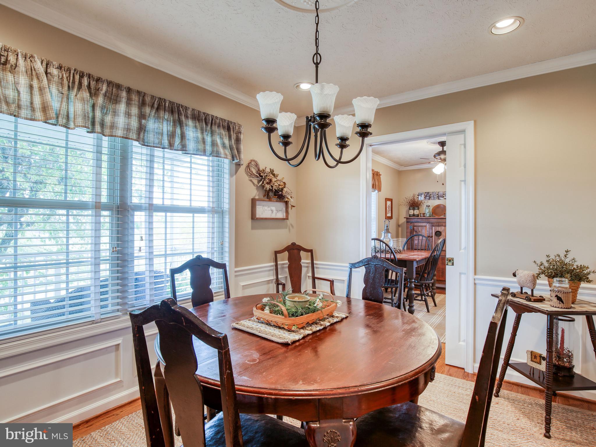 1714 Apple Pie Ridge Road Winchester, VA 22603 - Photo 15 of 44 Dining room with pocket doors and wood flooring