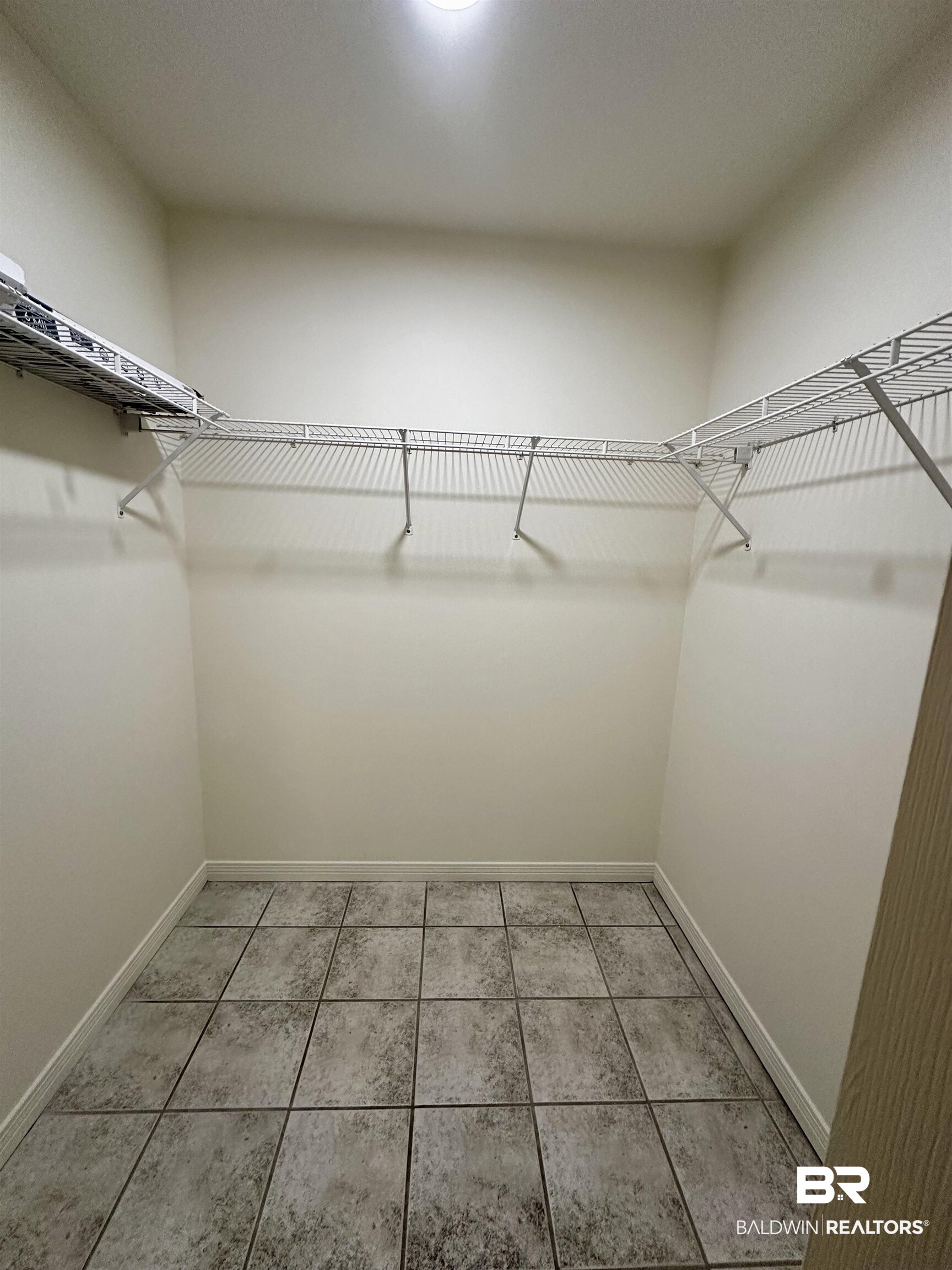 9090 Bay Pnes Road Elberta, AL 36530 - Photo 10 of 26 Walk in closet featuring tile patterned floors