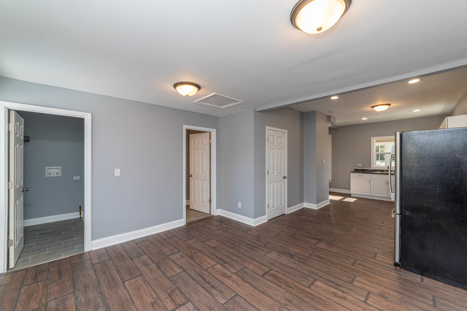 404 Garfield Road Harvard, IL 60033 - Photo 11 of 30 a view of an empty room with wooden floor and a bathroom