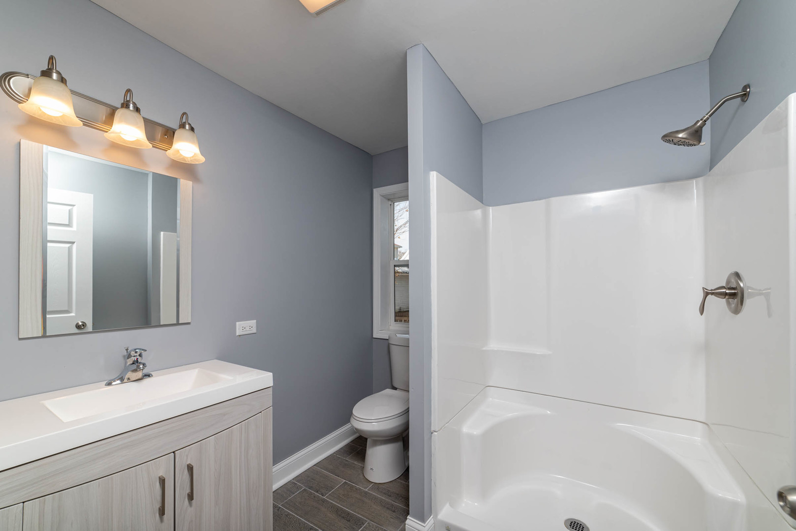 404 Garfield Road Harvard, IL 60033 - Photo 14 of 30 a bathroom with a sink toilet tub and shower