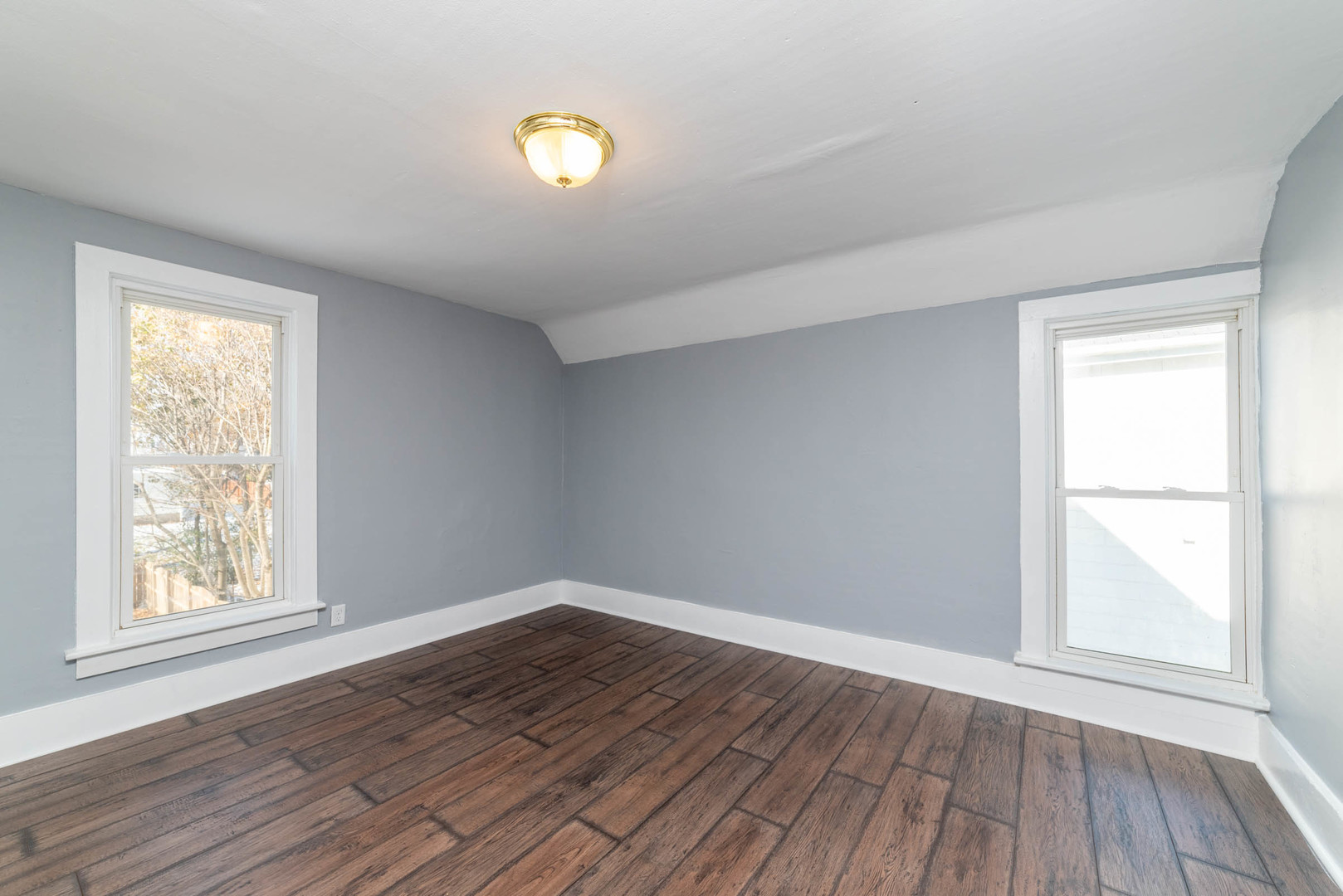 404 Garfield Road Harvard, IL 60033 - Photo 15 of 30 an empty room with wooden floor and windows
