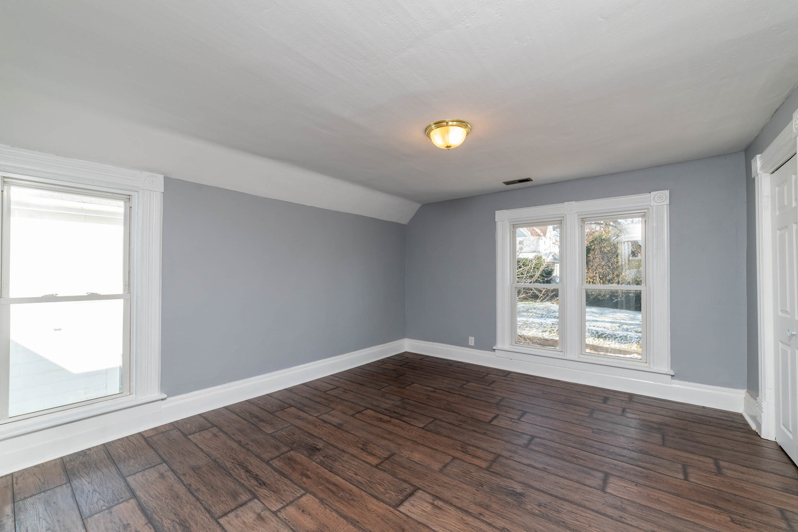 404 Garfield Road Harvard, IL 60033 - Photo 16 of 30 a view of an empty room with wooden floor and a window