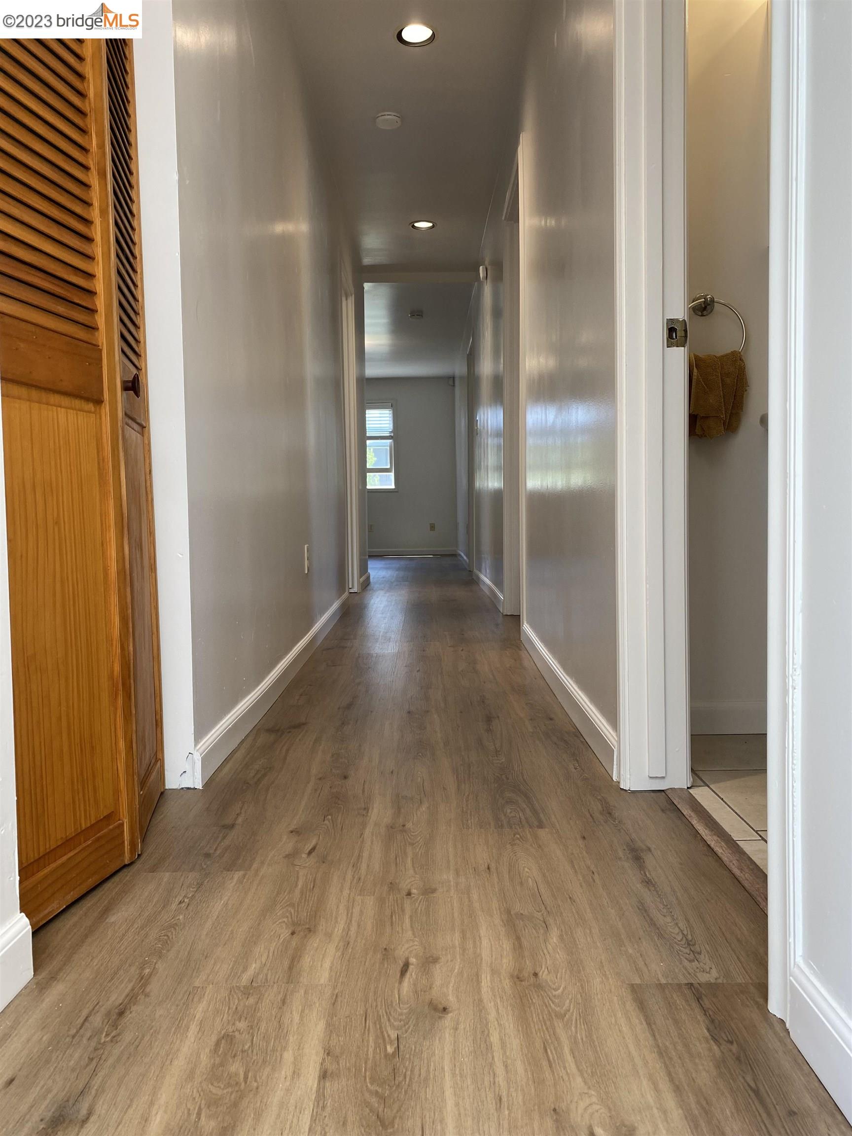 Rockridge Oakland, CA 94609 - Photo 16 of 31 a view of a hallway with wooden floor