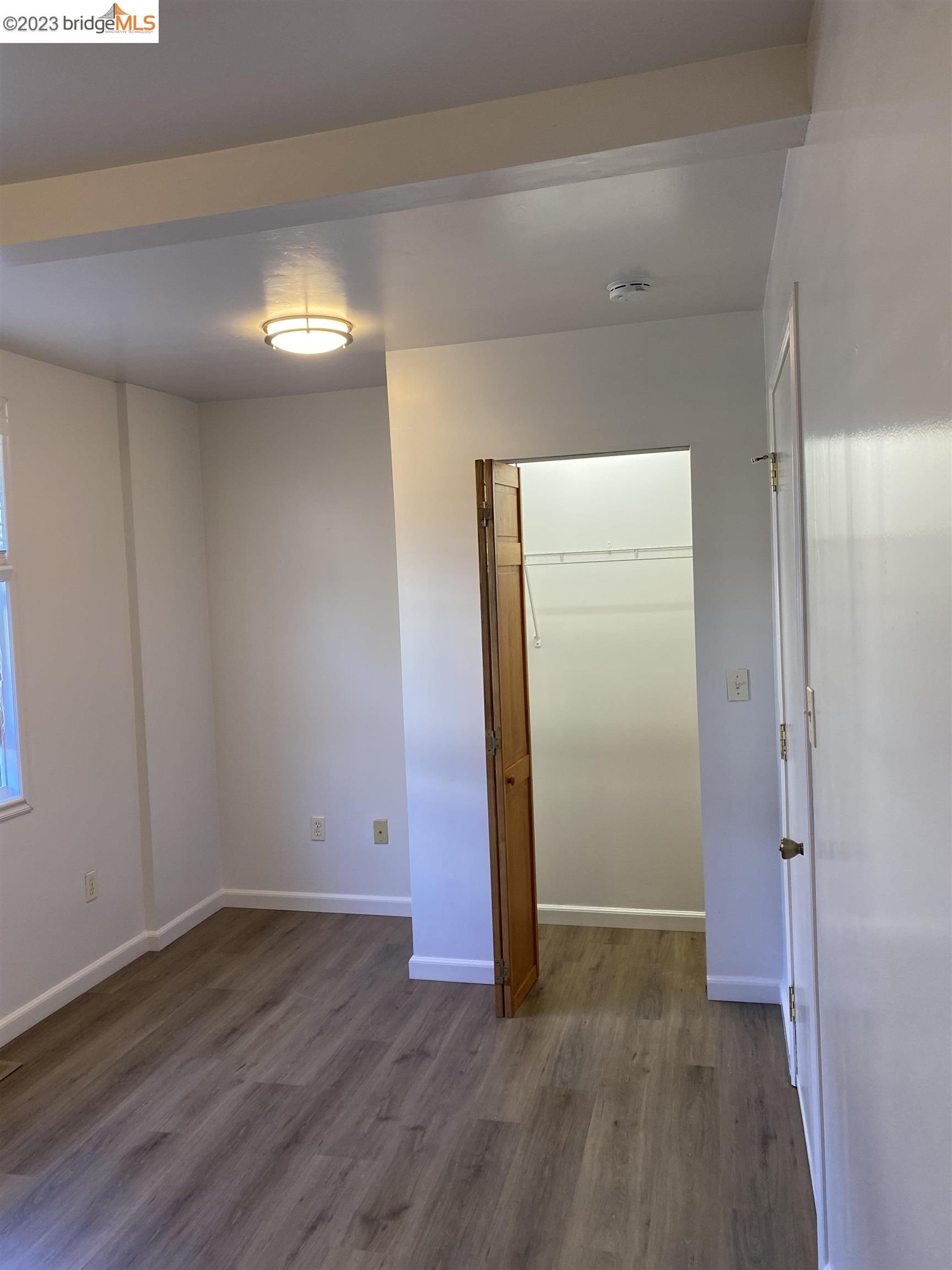 Rockridge Oakland, CA 94609 - Photo 18 of 31 a view of an empty room with wooden floor