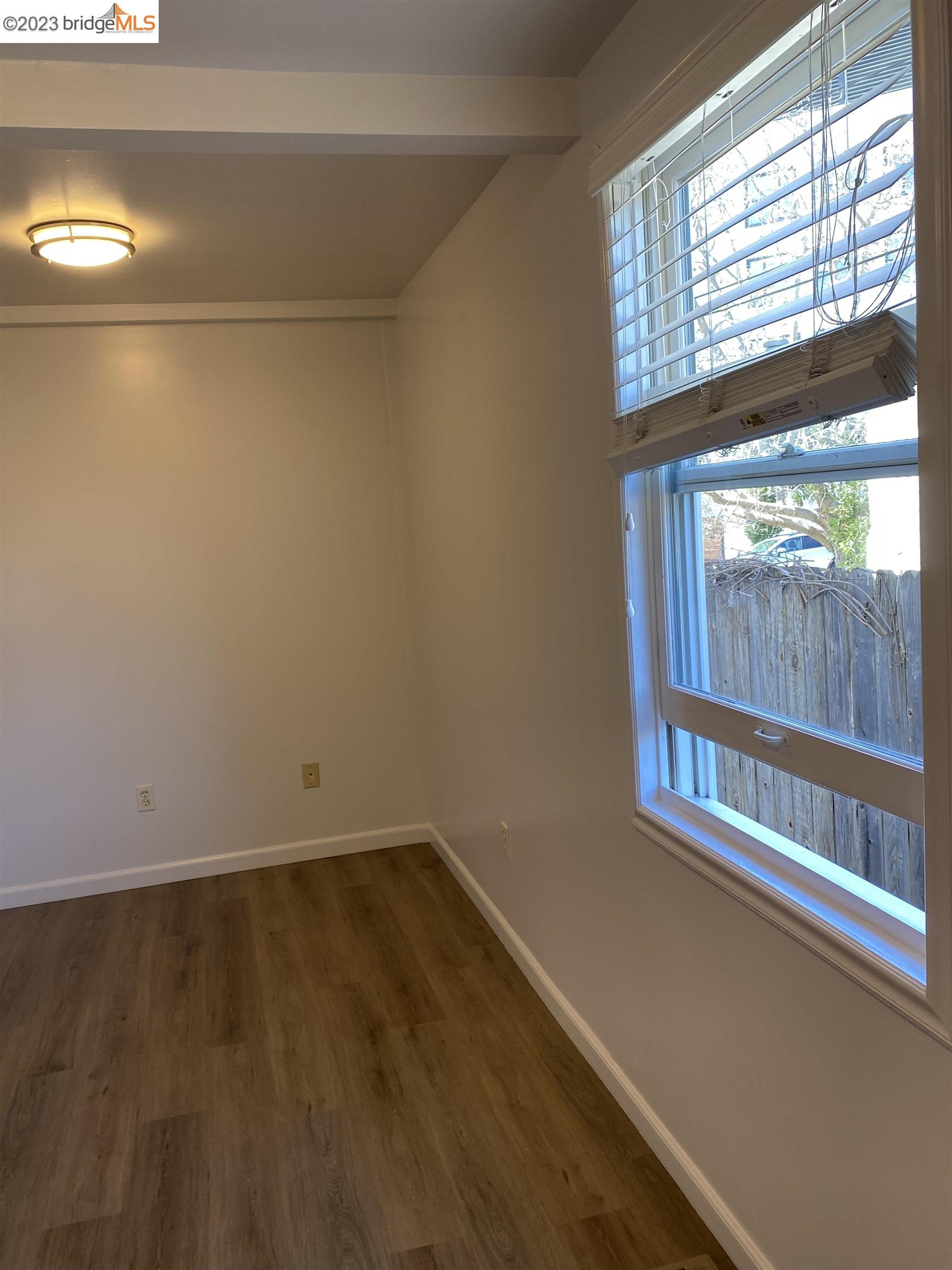 Rockridge Oakland, CA 94609 - Photo 19 of 31 a view of a small space with wooden floor and a window