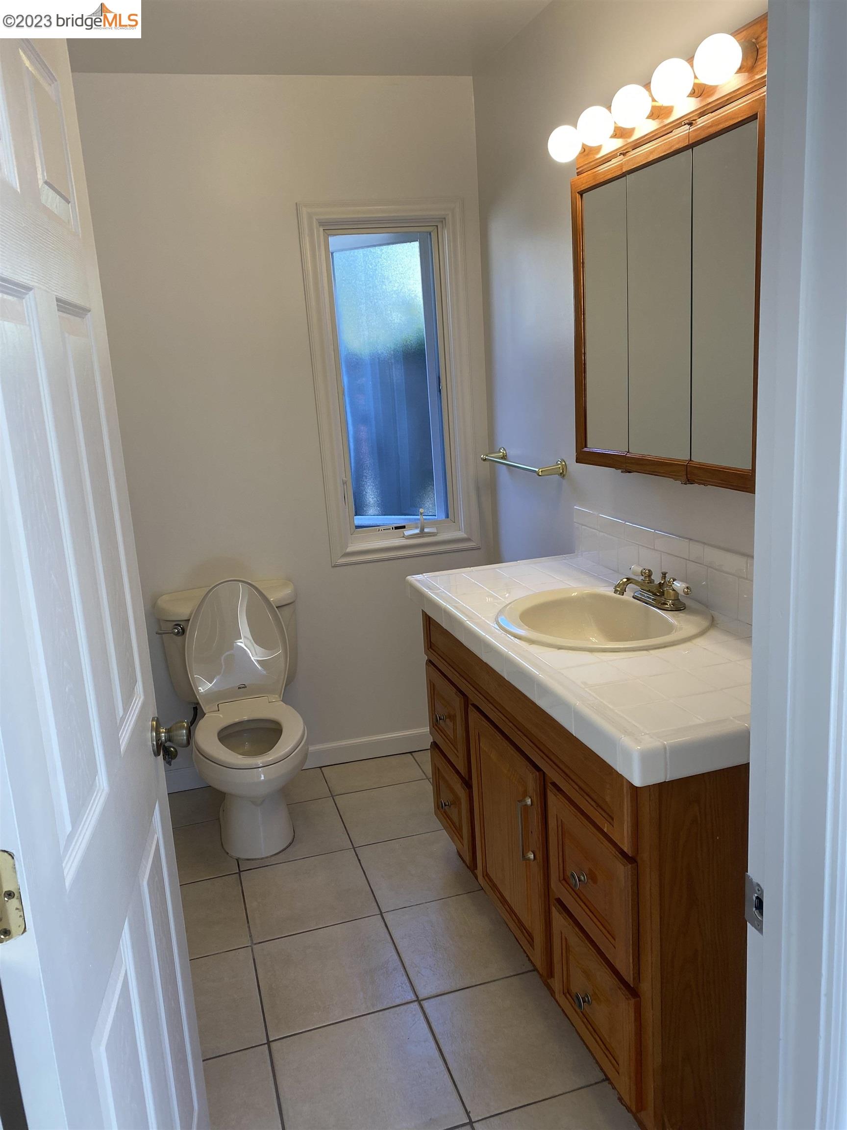 Rockridge Oakland, CA 94609 - Photo 25 of 31 a bathroom with a sink toilet and mirror