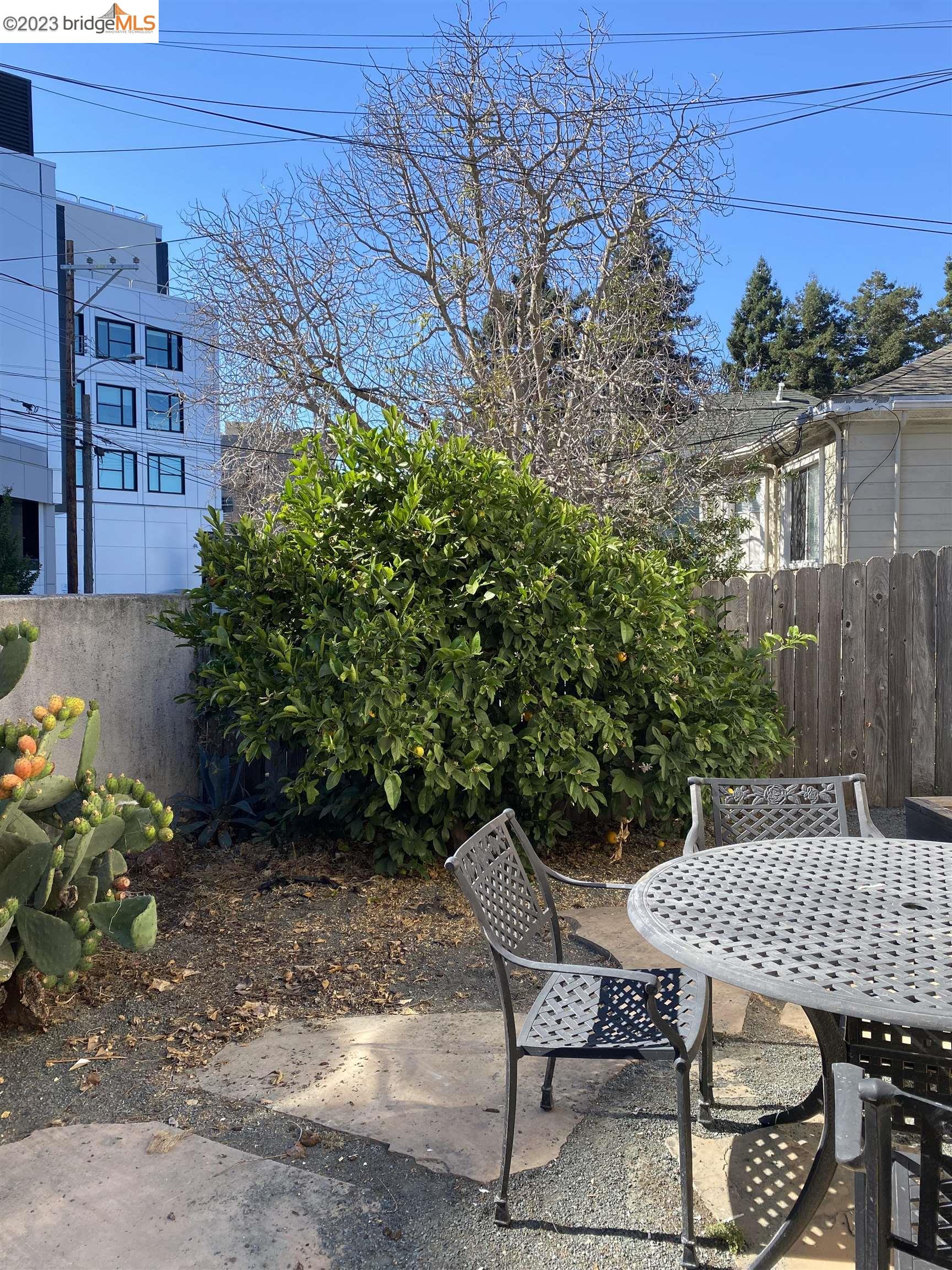 Rockridge Oakland, CA 94609 - Photo 29 of 31 a view of a patio with table and chairs and potted plants