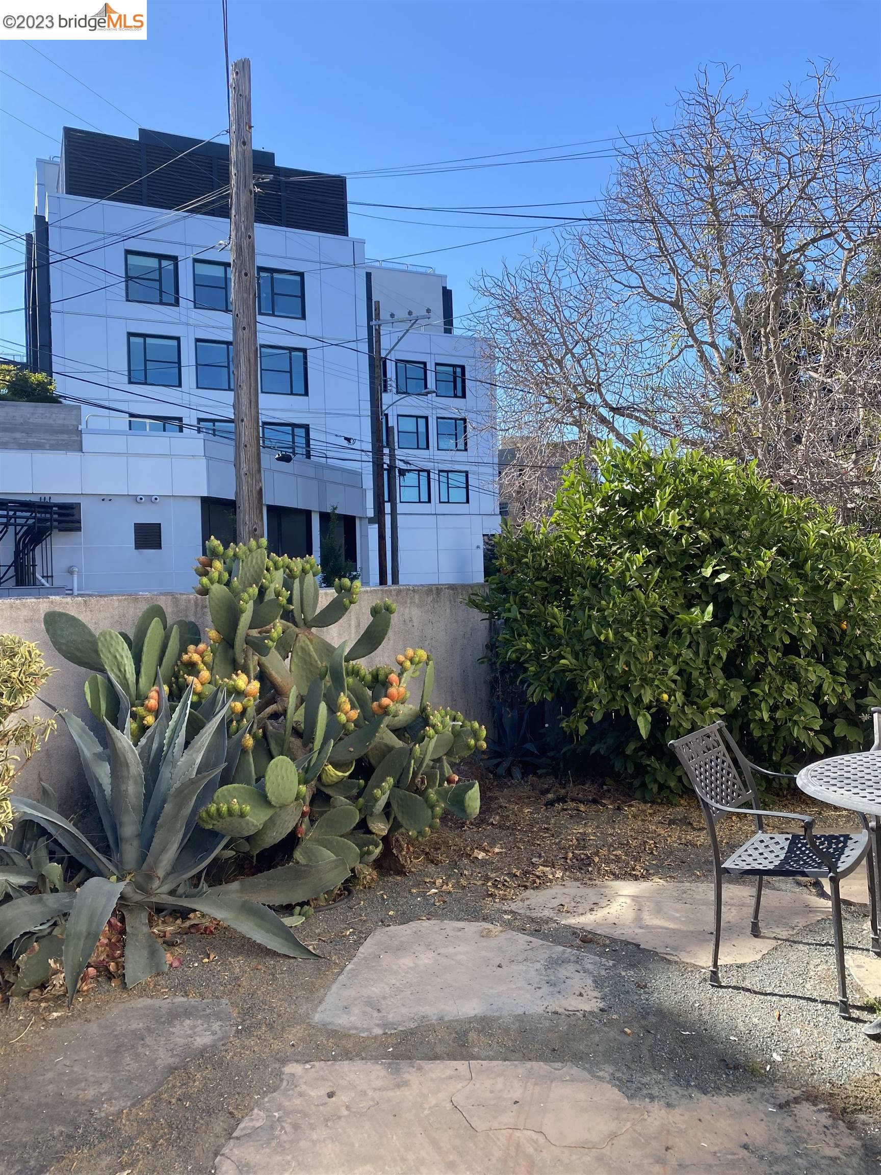 Rockridge Oakland, CA 94609 - Photo 5 of 31 a backyard of a house with chairs