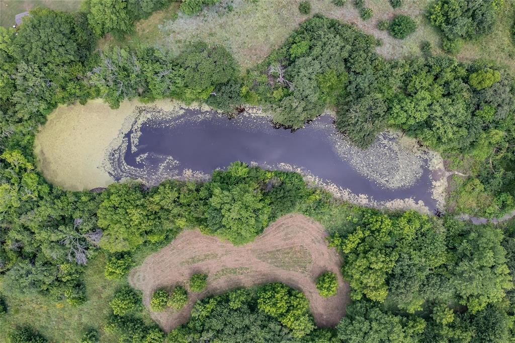 4001 Curry Road Arlington, TX 76001 - Photo 11 of 31 an aerial view of a house with a yard and outdoor seating