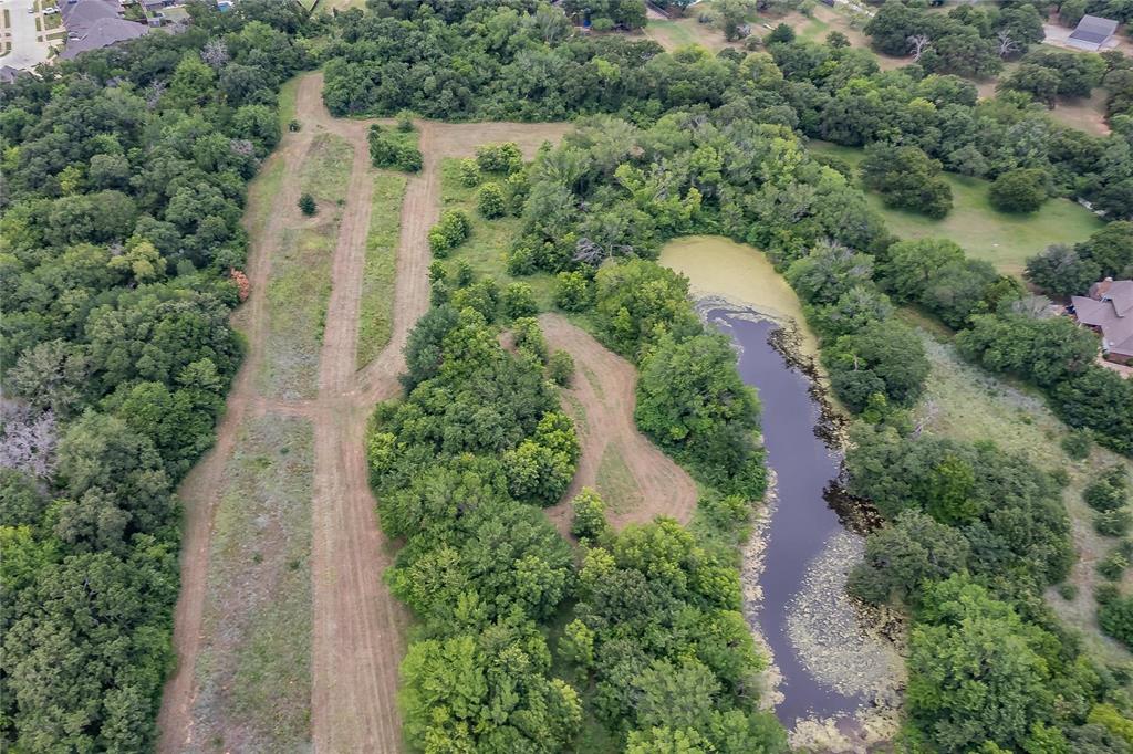 4001 Curry Road Arlington, TX 76001 - Photo 12 of 31 an aerial view of residential house with outdoor space and trees all around