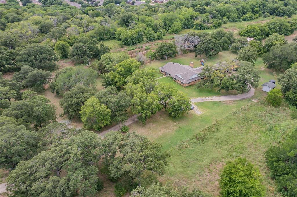 4001 Curry Road Arlington, TX 76001 - Photo 22 of 31 an aerial view of residential house with outdoor space and trees all around