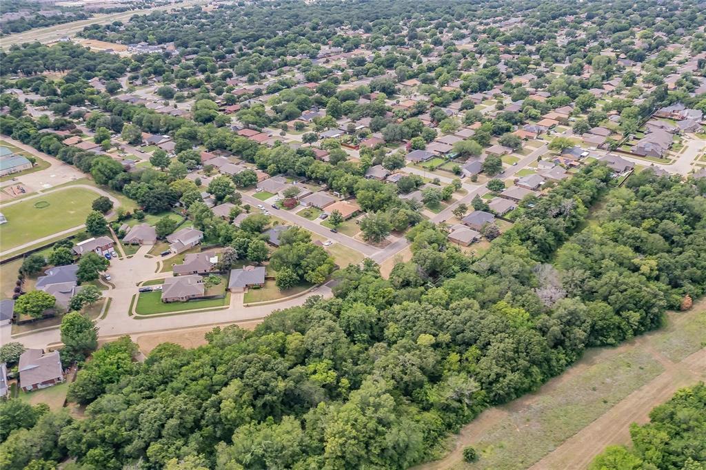 4001 Curry Road Arlington, TX 76001 - Photo 27 of 31 an aerial view of residential house with outdoor space and trees all around