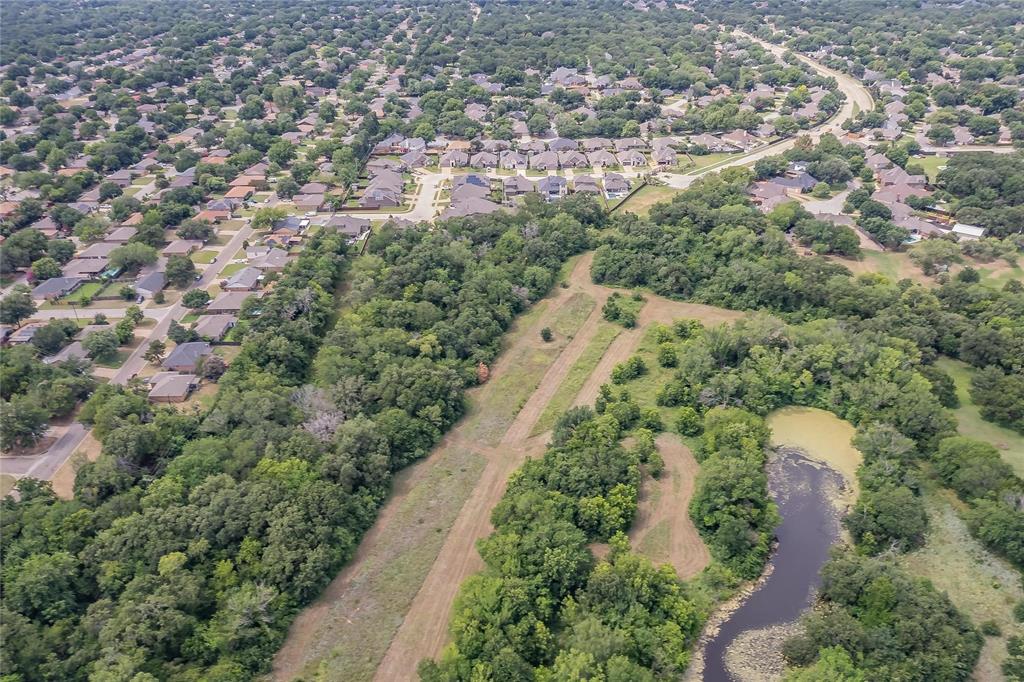 4001 Curry Road Arlington, TX 76001 - Photo 28 of 31 an aerial view of a residential houses with outdoor space and trees