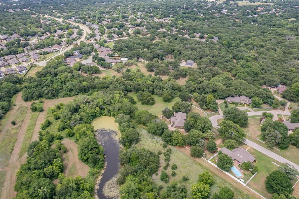 4001 Curry Road Arlington, TX 76001 - Photo 29 of 31 an aerial view of a house with a yard and lake view