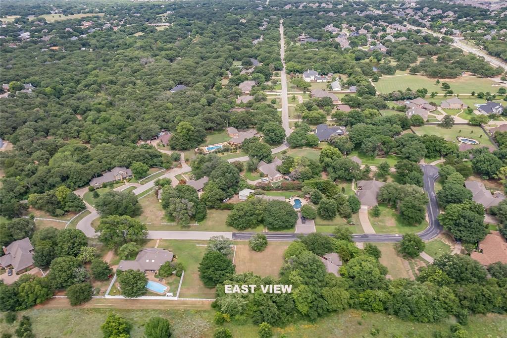 4001 Curry Road Arlington, TX 76001 - Photo 4 of 31 an aerial view of residential houses with outdoor space and trees