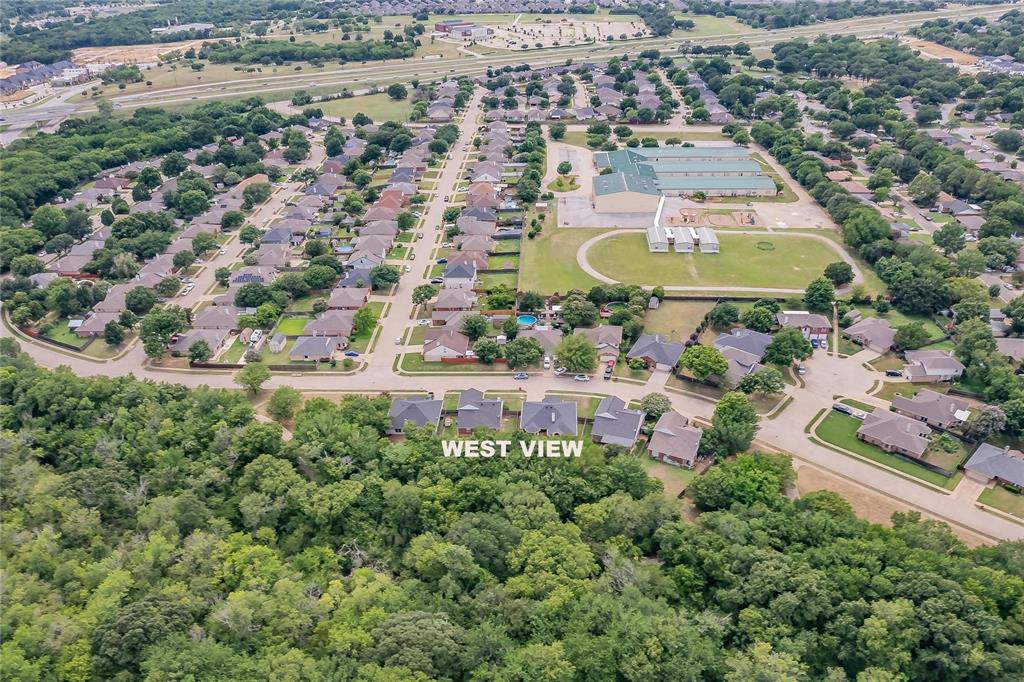 4001 Curry Road Arlington, TX 76001 - Photo 7 of 31 an aerial view of a house with a swimming pool outdoor seating and yard