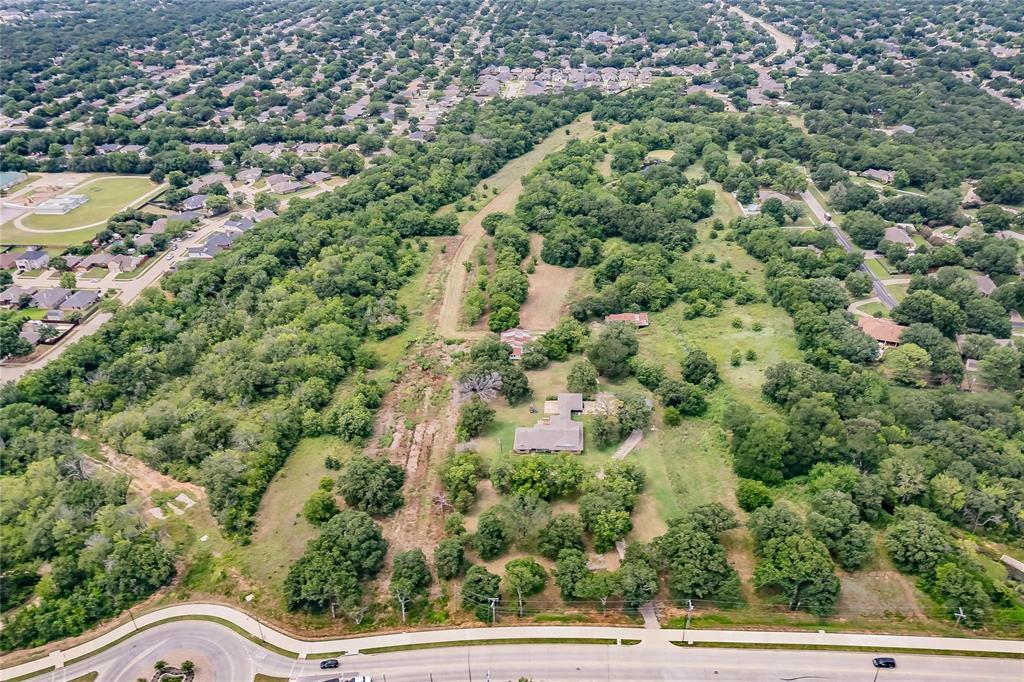 4001 Curry Road Arlington, TX 76001 - Photo 8 of 31 an aerial view of residential houses with outdoor space and trees