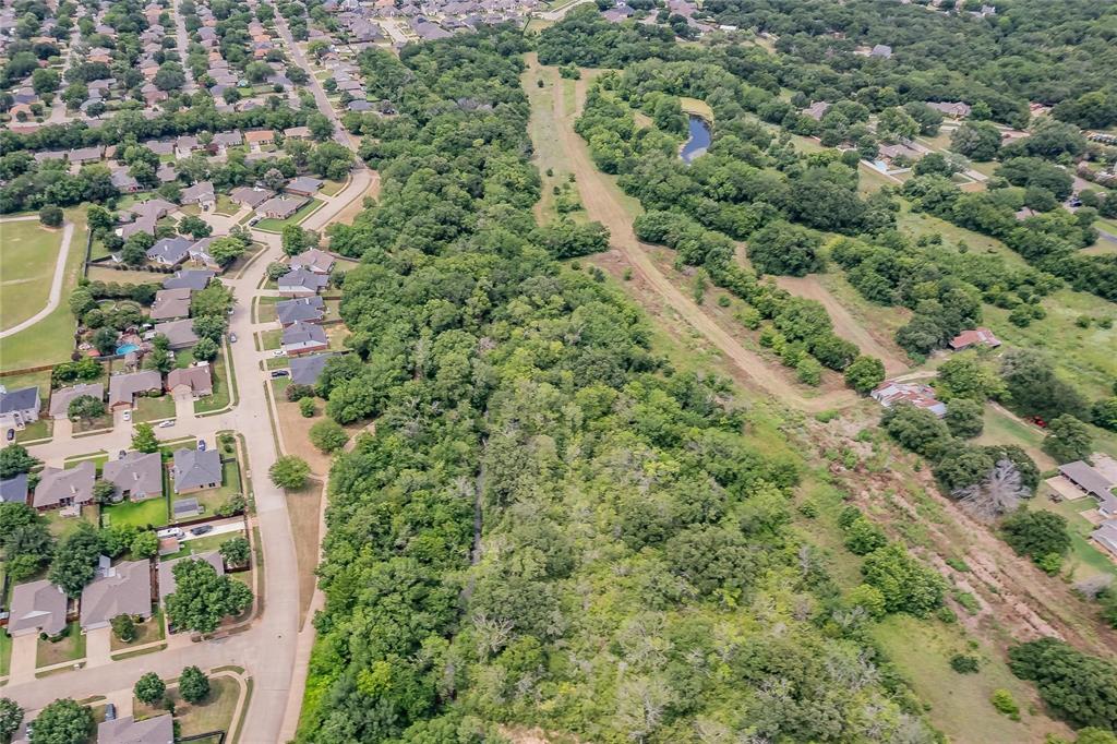 4001 Curry Road Arlington, TX 76001 - Photo 9 of 31 an aerial view of residential houses with outdoor space and trees