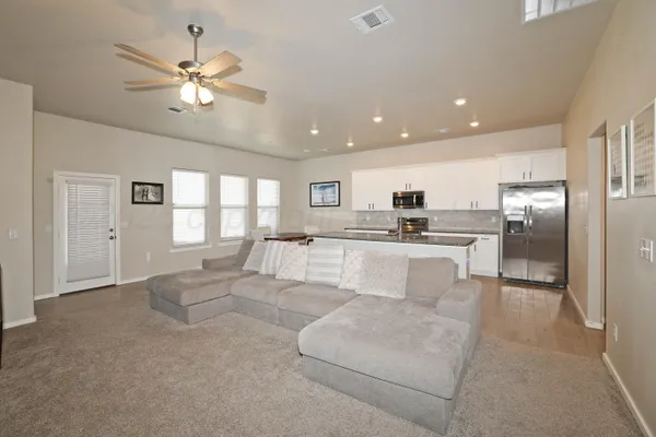 a living room with a fireplace and a flat screen tv