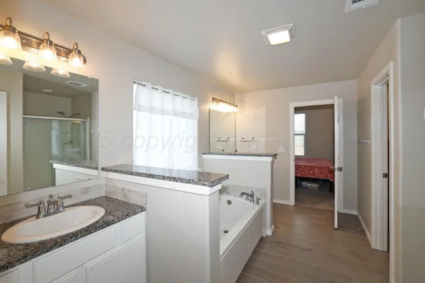 a bedroom with furniture and a window