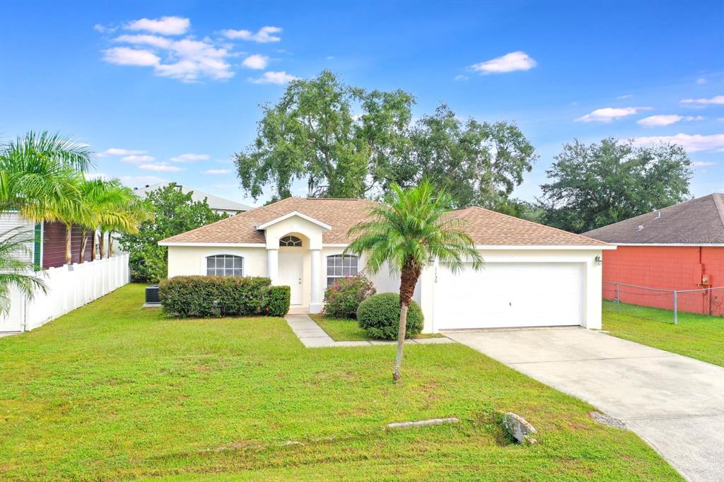 1150 Orne Court Kissimmee, FL 34759 - Photo 1 of 1 a front view of house with yard and green space