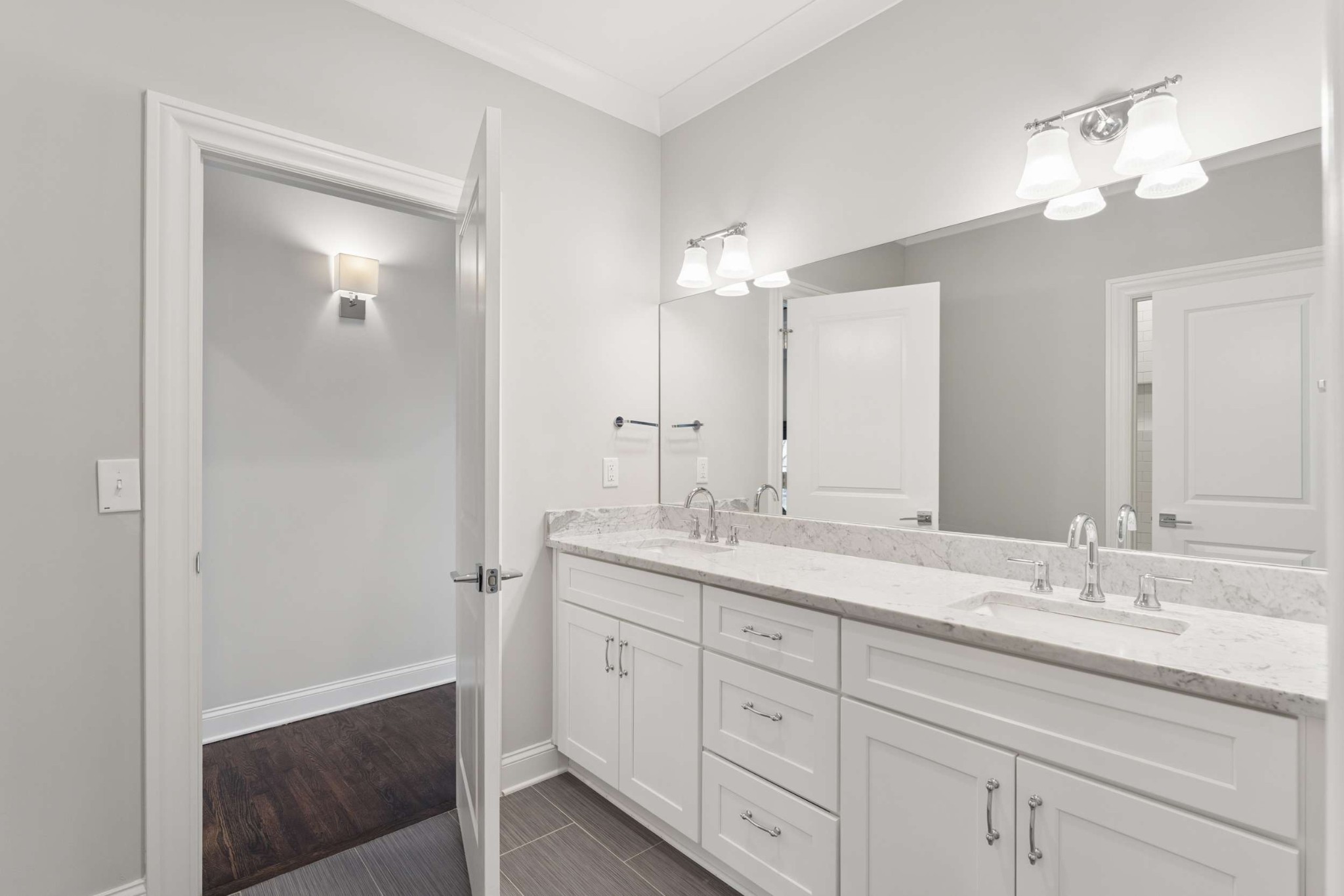 3705 B Estes Road Nashville, TN 37215 - Photo 38 of 61 a bathroom with a double vanity sink and mirror