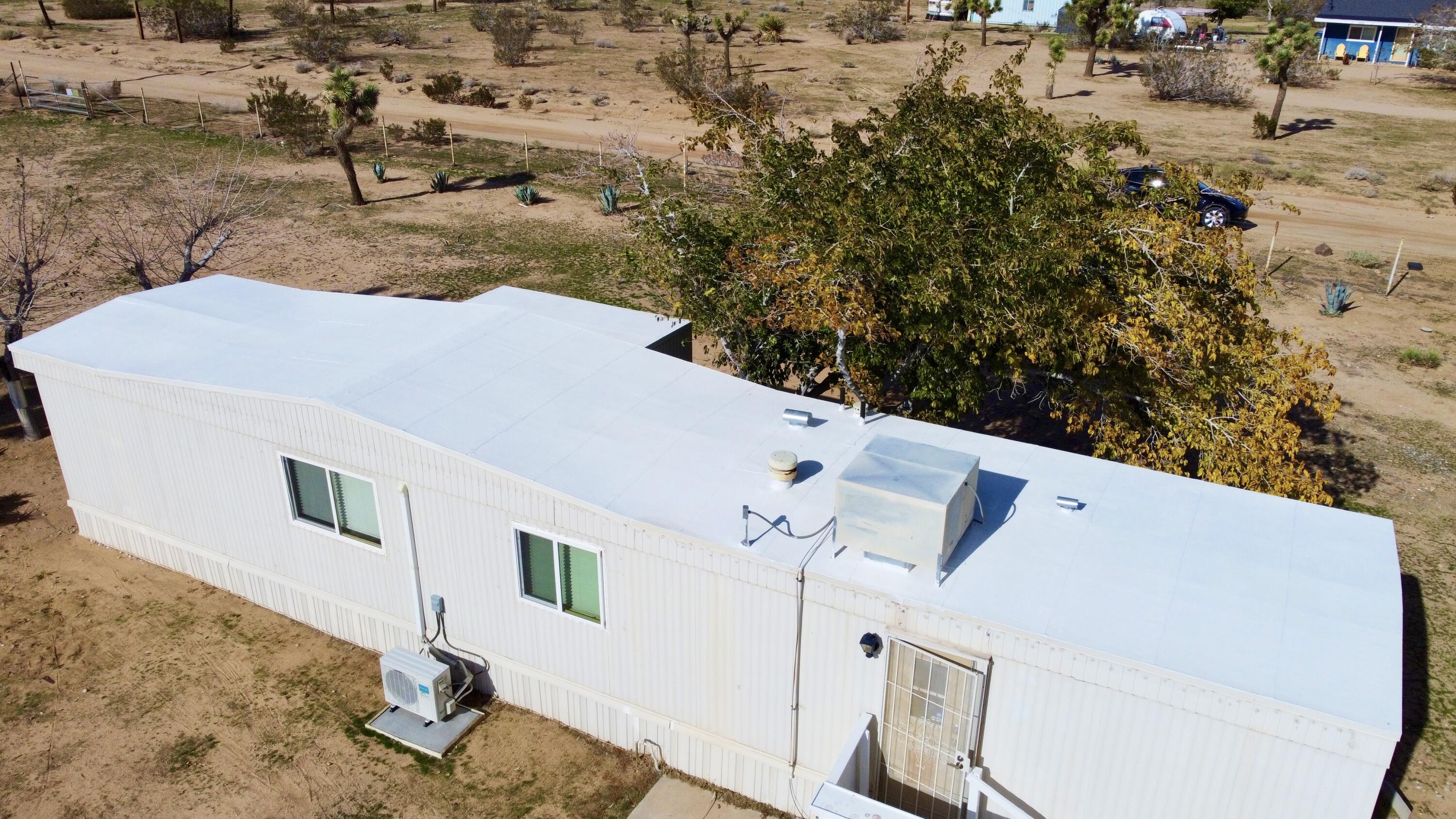 57775 Junipero Trail Yucca Valley, CA 92284 - Photo 18 of 19 a view of a house with a backyard
