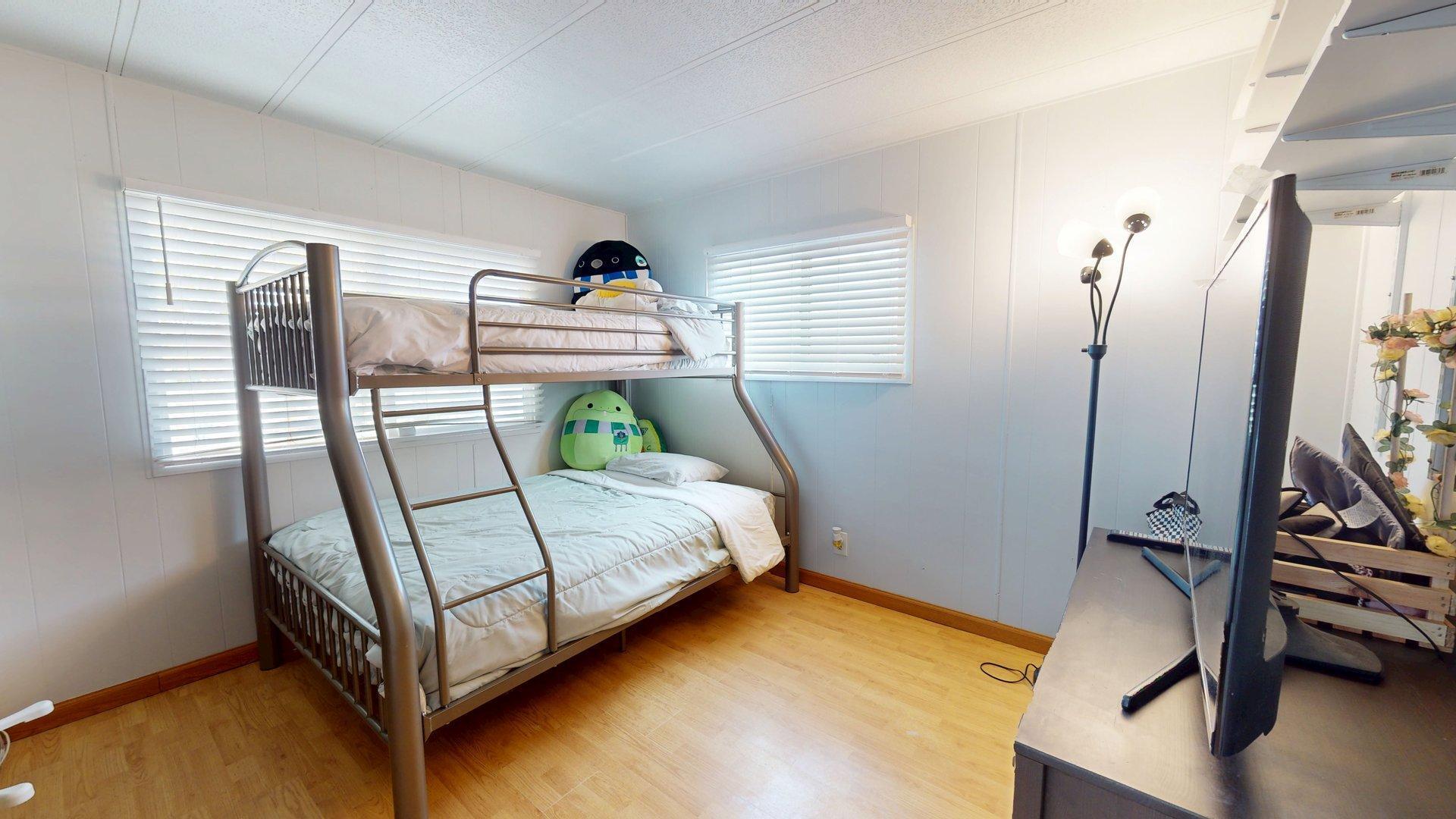 57775 Junipero Trail Yucca Valley, CA 92284 - Photo 3 of 19 a bedroom with a bed and a window