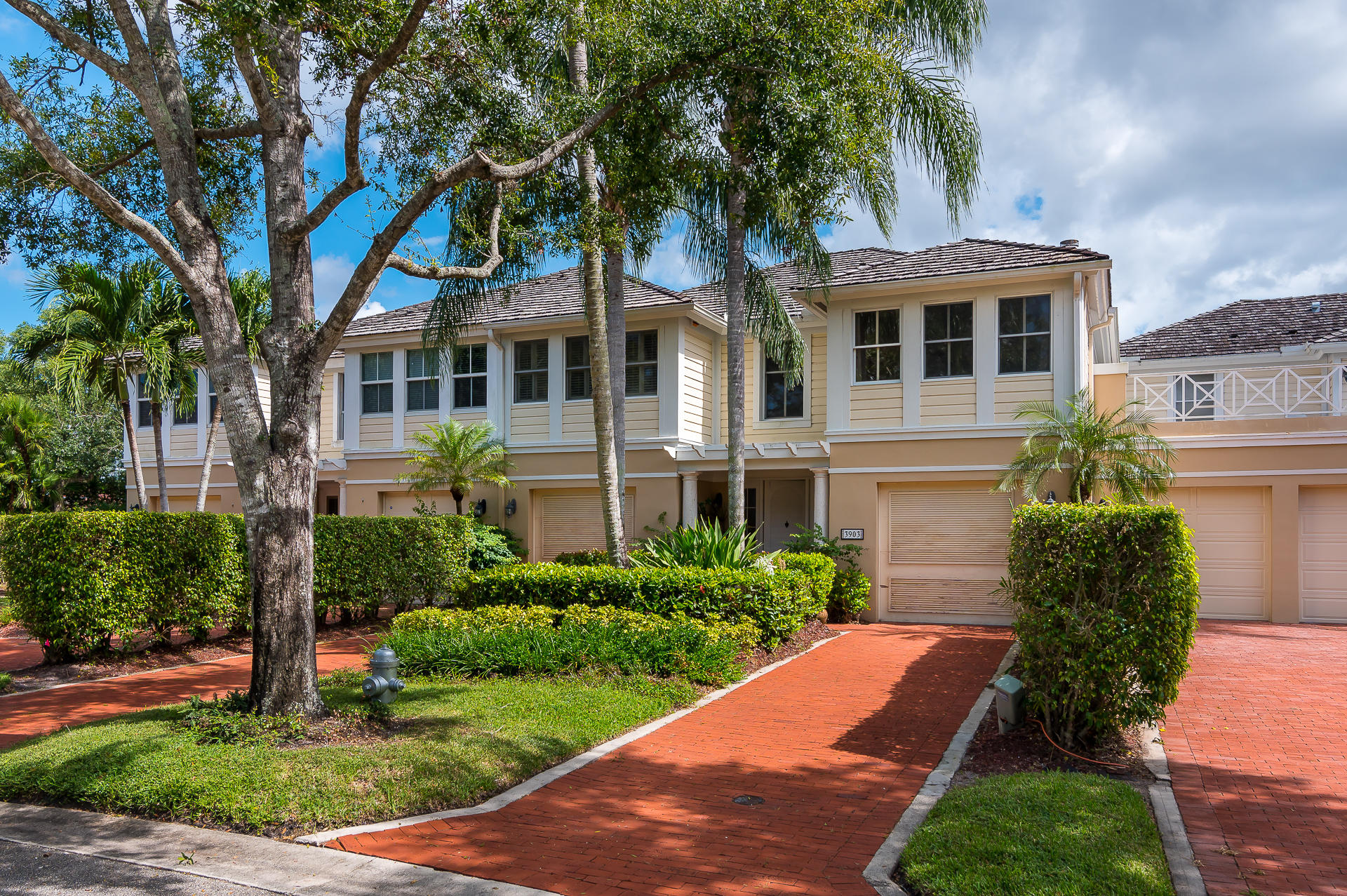 3903 Northwest 58th Street, Unit 38 Boca Raton, FL 33496 - Photo 1 of 30 a front view of a house with a garden