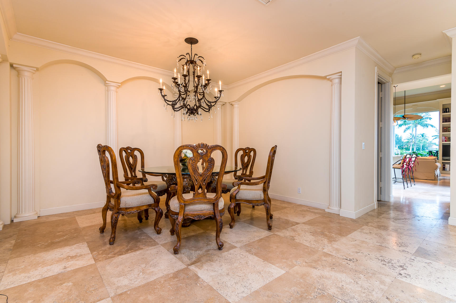 3903 Northwest 58th Street, Unit 38 Boca Raton, FL 33496 - Photo 12 of 30 a view of a dining room with furniture and chandelier