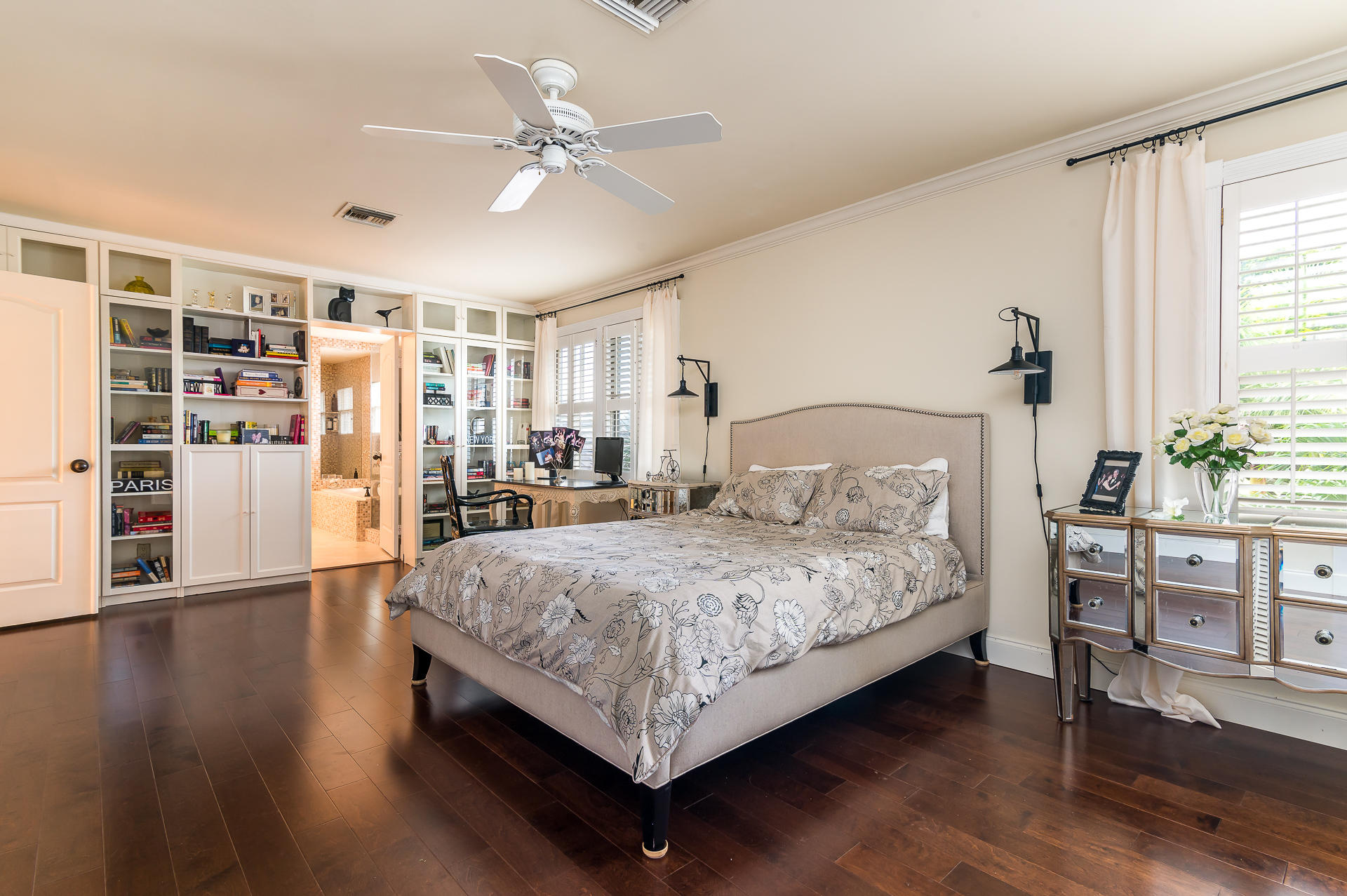 3903 Northwest 58th Street, Unit 38 Boca Raton, FL 33496 - Photo 15 of 30 a bedroom with a large bed wooden floor and window