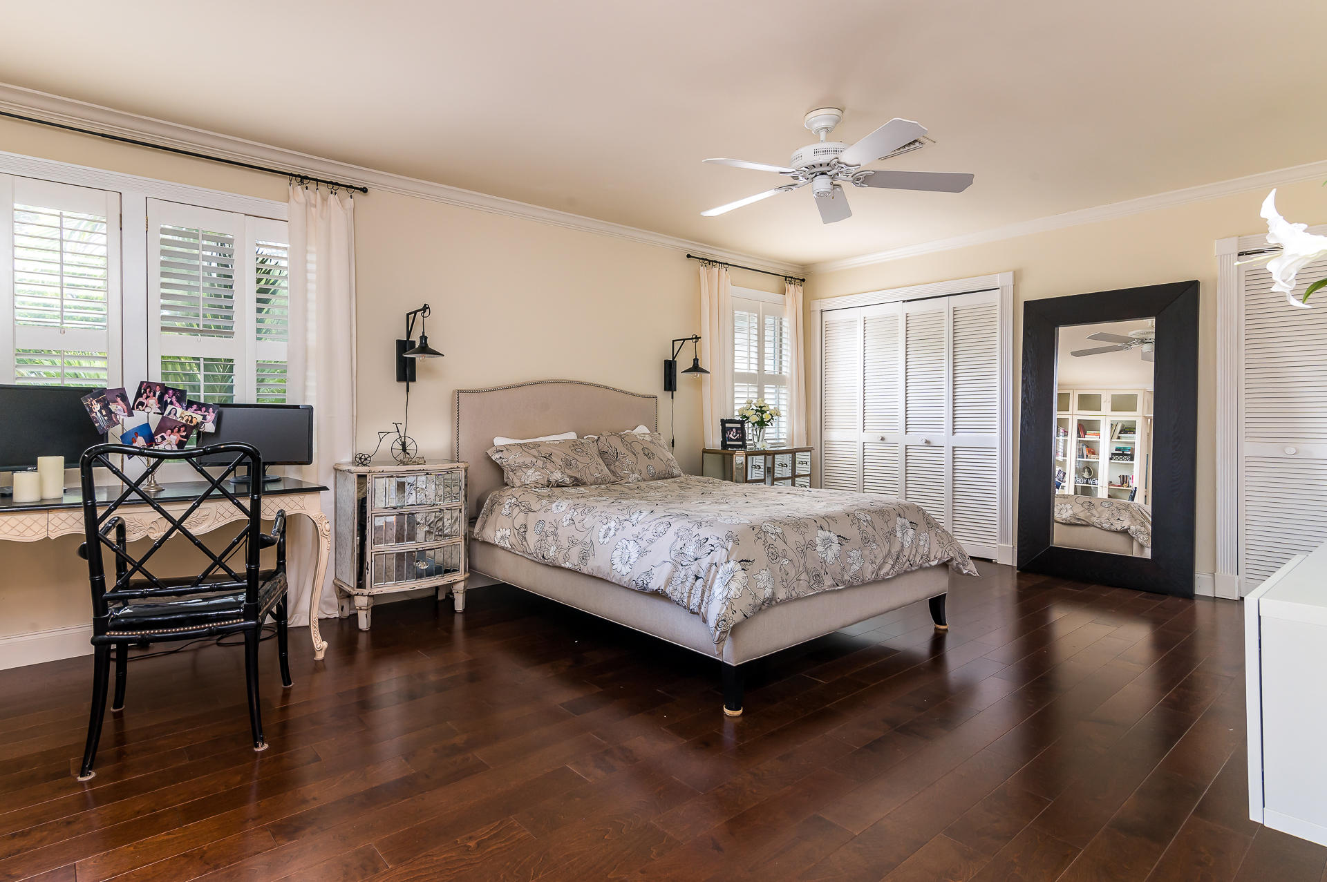 3903 Northwest 58th Street, Unit 38 Boca Raton, FL 33496 - Photo 16 of 30 a bedroom with a bed and a chandelier