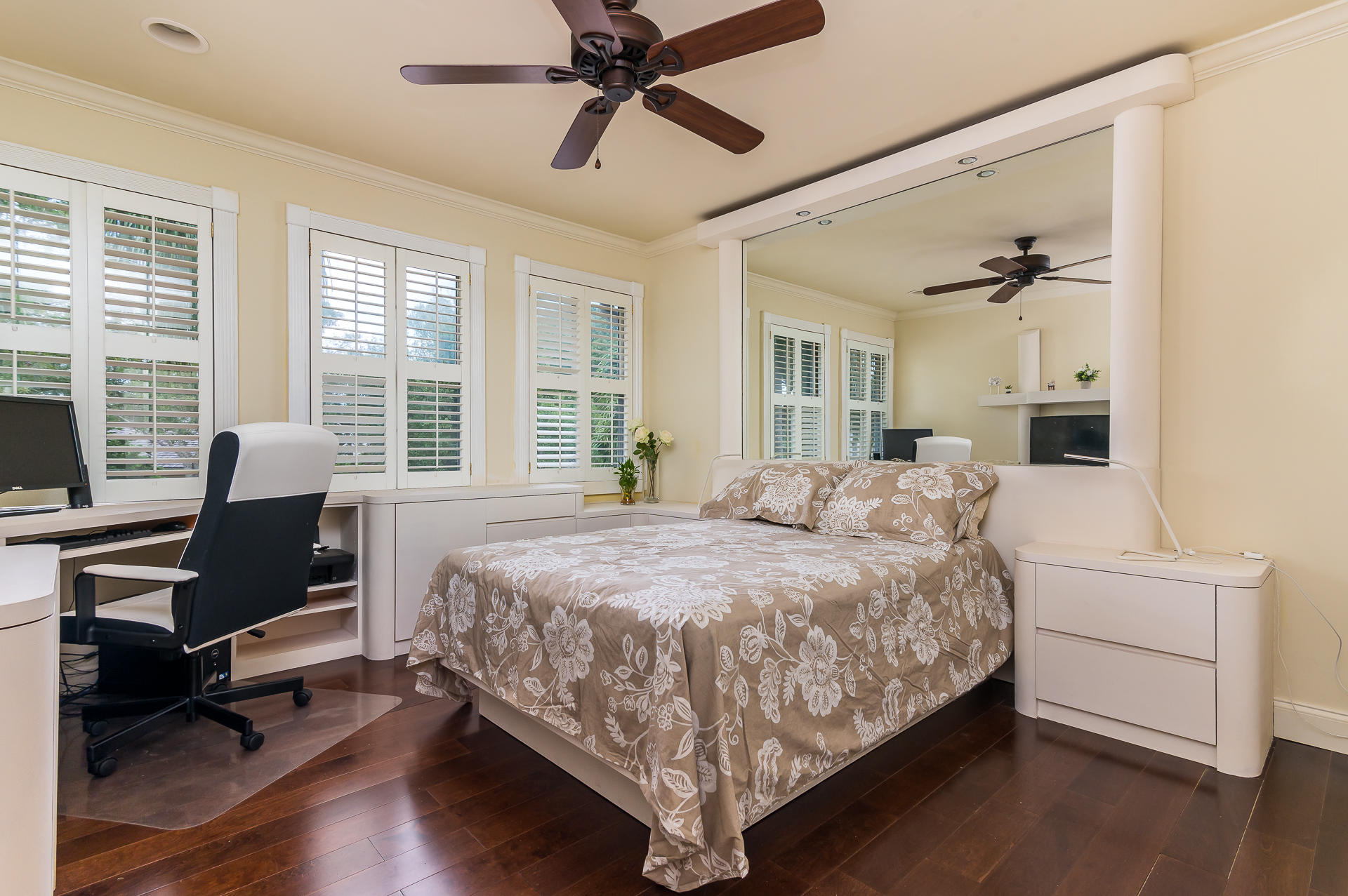 3903 Northwest 58th Street, Unit 38 Boca Raton, FL 33496 - Photo 21 of 30 a bedroom with a bed and wooden floor
