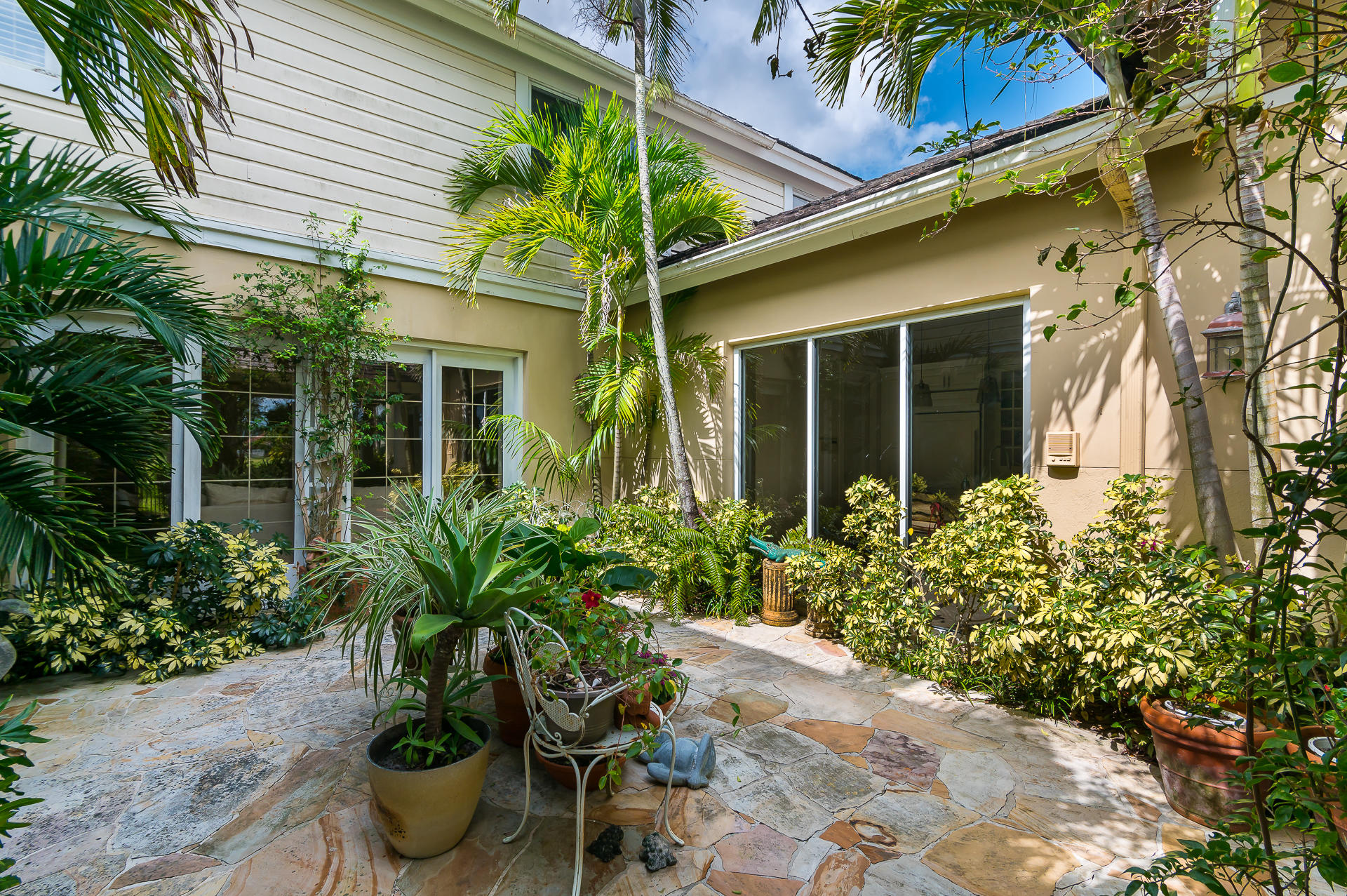 3903 Northwest 58th Street, Unit 38 Boca Raton, FL 33496 - Photo 25 of 30 a potted plant in front of a house