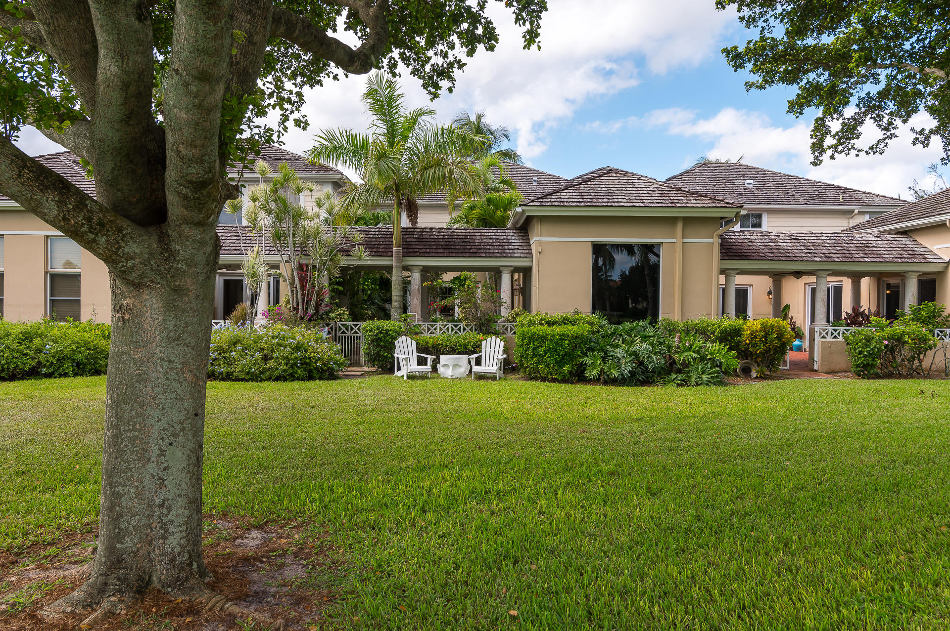 3903 Northwest 58th Street, Unit 38 Boca Raton, FL 33496 - Photo 28 of 30 a front view of a house with a yard