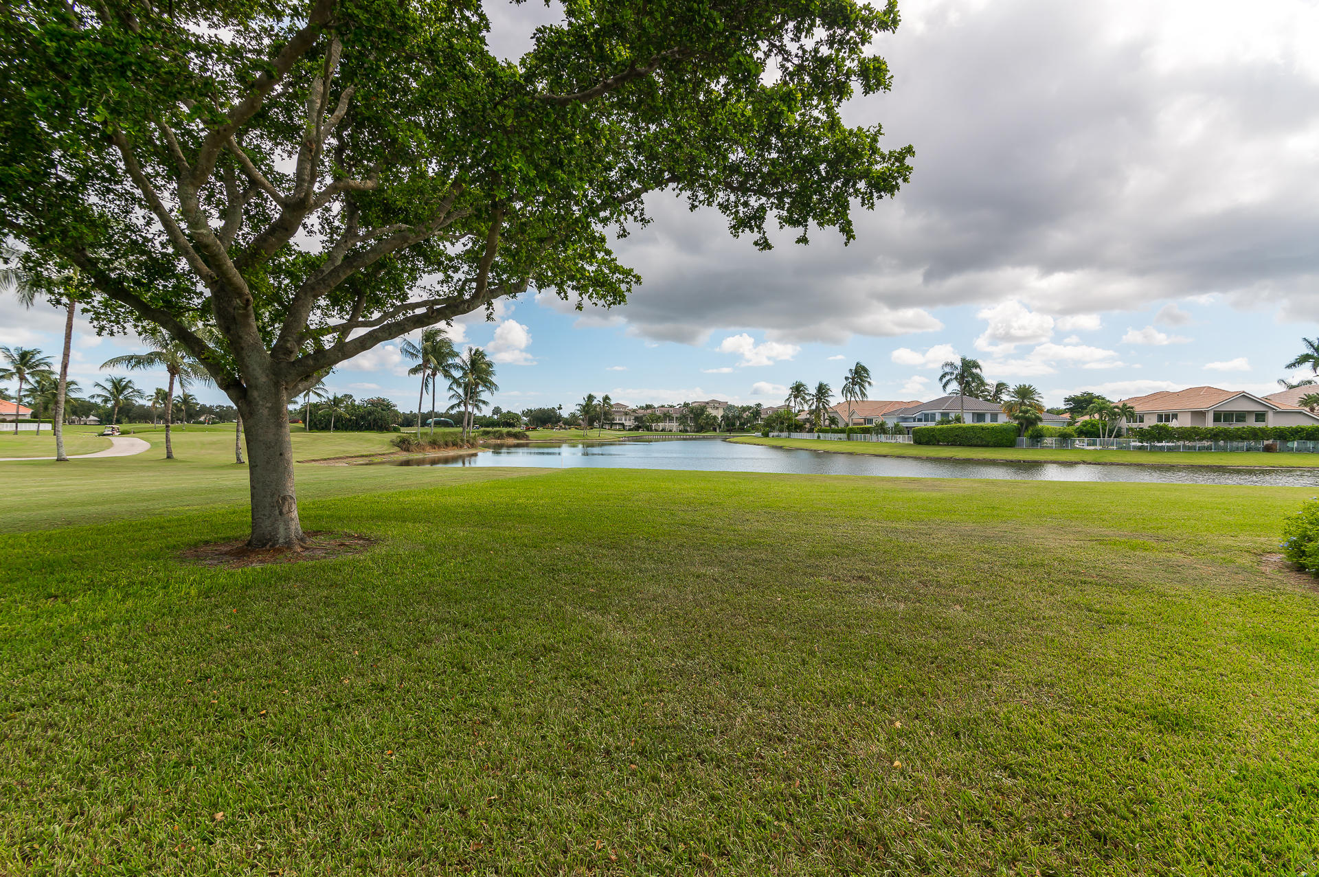3903 Northwest 58th Street, Unit 38 Boca Raton, FL 33496 - Photo 29 of 30 a view of an ocean with a large trees and covered with trees in the background