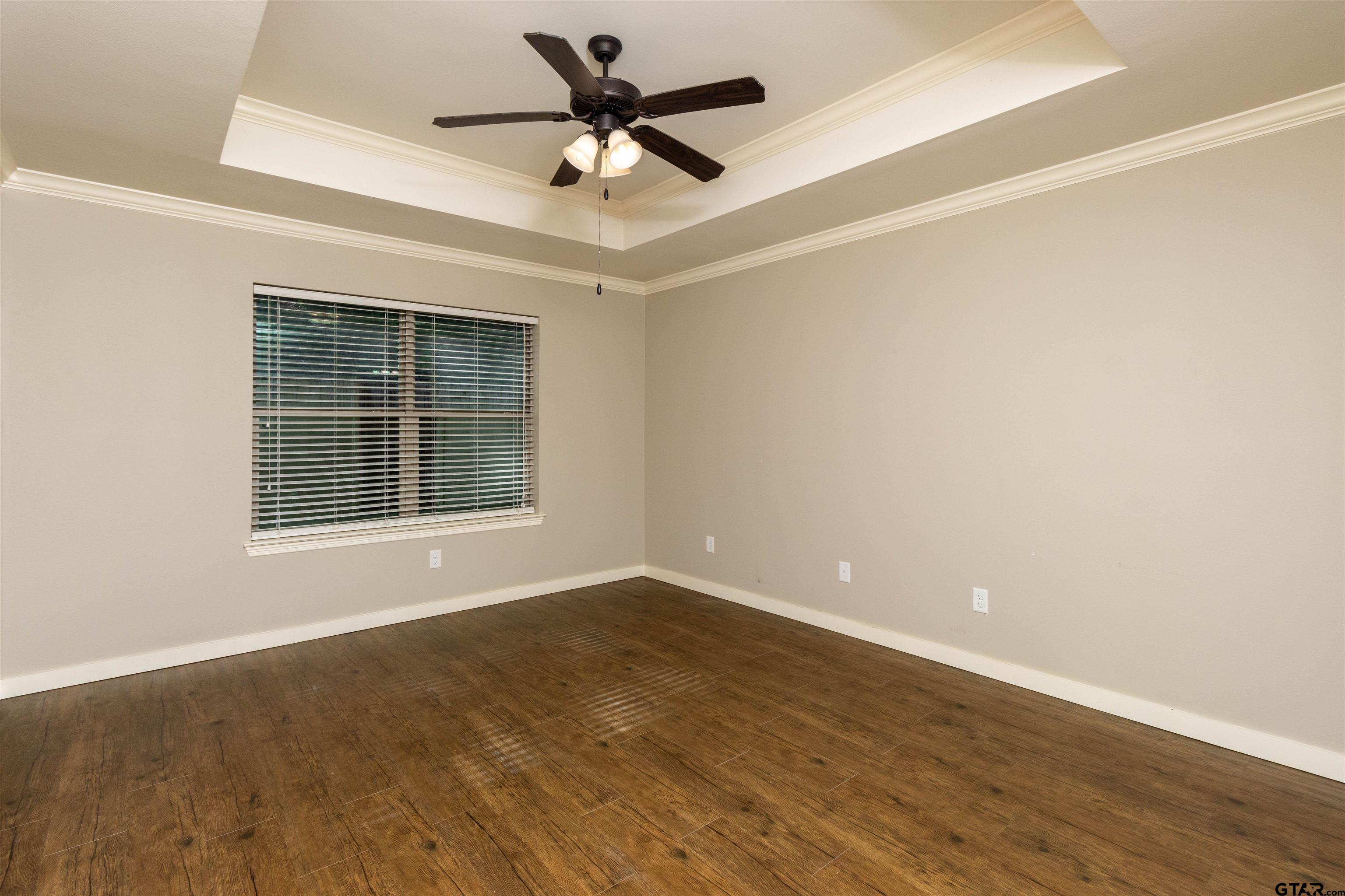 5106 Shiloh Ridge Drive Tyler, TX 75703 - Photo 14 of 19 an empty room with wooden floor and windows