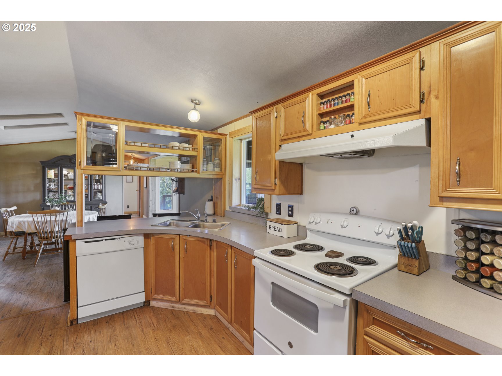 26748 Wonderly Road Rainier, OR 97048 - Photo 12 of 27 a kitchen with a sink a stove and cabinets