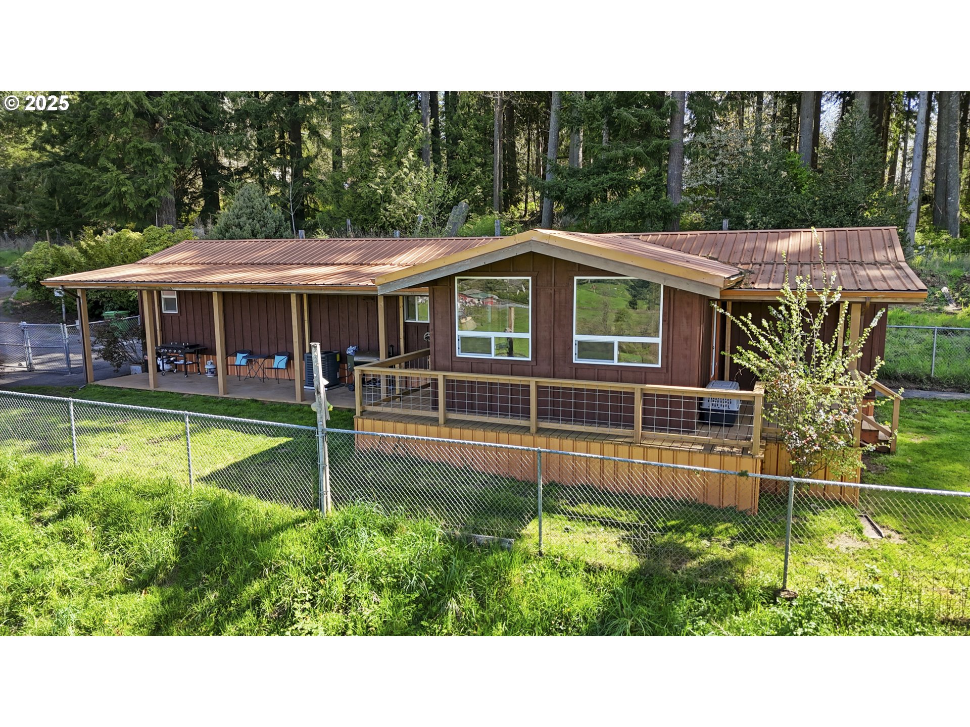 26748 Wonderly Road Rainier, OR 97048 - Photo 2 of 27 a view of a house with a backyard