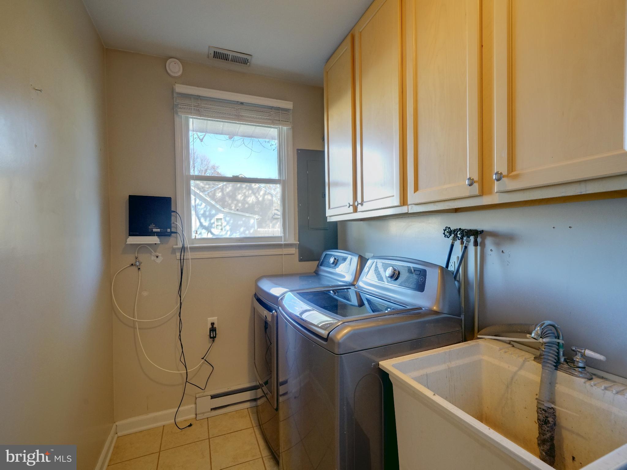 7819 Appletree Road Pasadena, MD 21122 - Photo 16 of 59 Bright and functional laundry space.