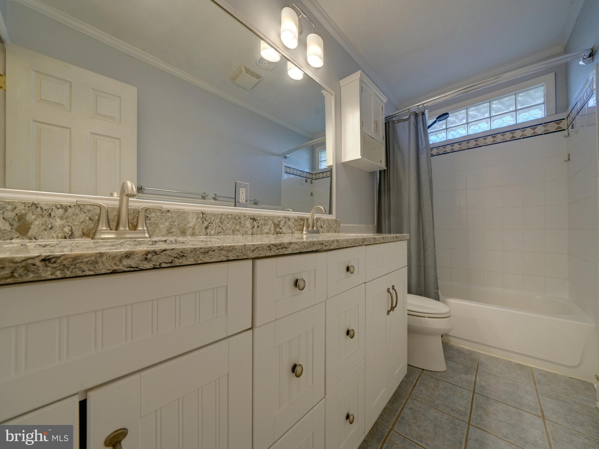 7819 Appletree Road Pasadena, MD 21122 - Photo 20 of 59 Elegant bathroom with modern finishes.